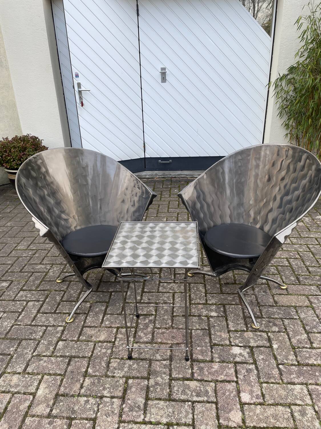 2 cone chairs and a table by Steel-Line