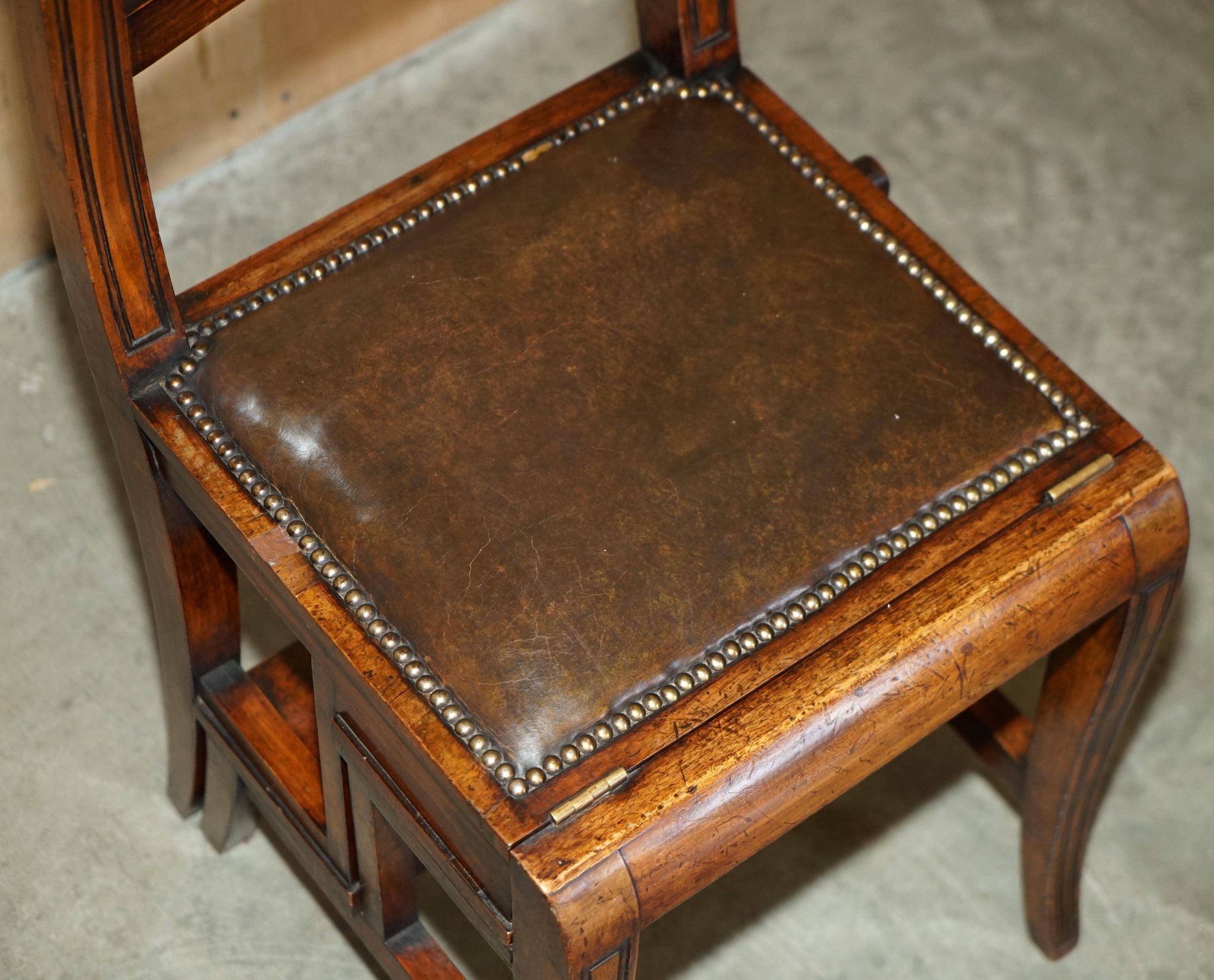 Victorian library chair, convertible, hardwood, leather, brass, circa 1880.