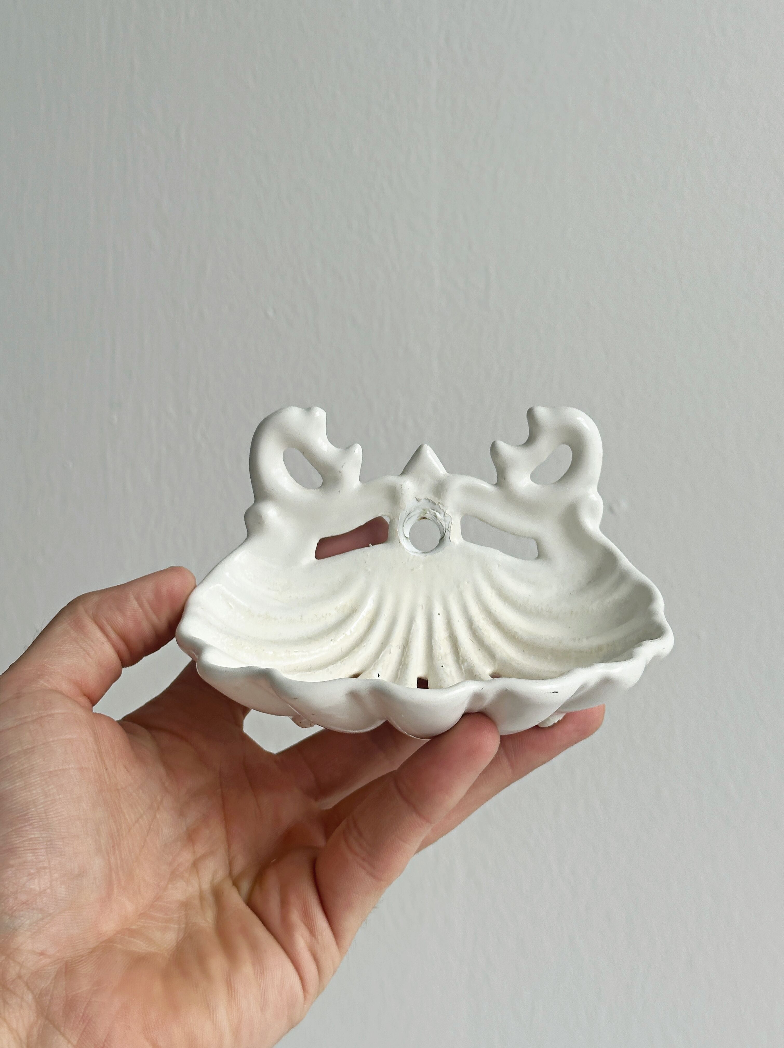 Bathroom décor, hooks, soap dish, white metal hangers.