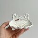 Bathroom décor, hooks, soap dish, white metal hangers.