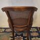 Half-moon rattan and hardwood armchair, early 20th century