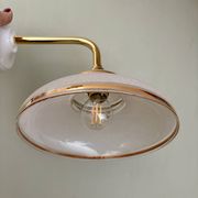 Vintage elbow wall lamp with white and gold granite glass shade