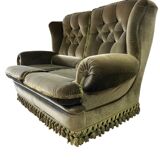 Vintage green two-seater sofa with fringes