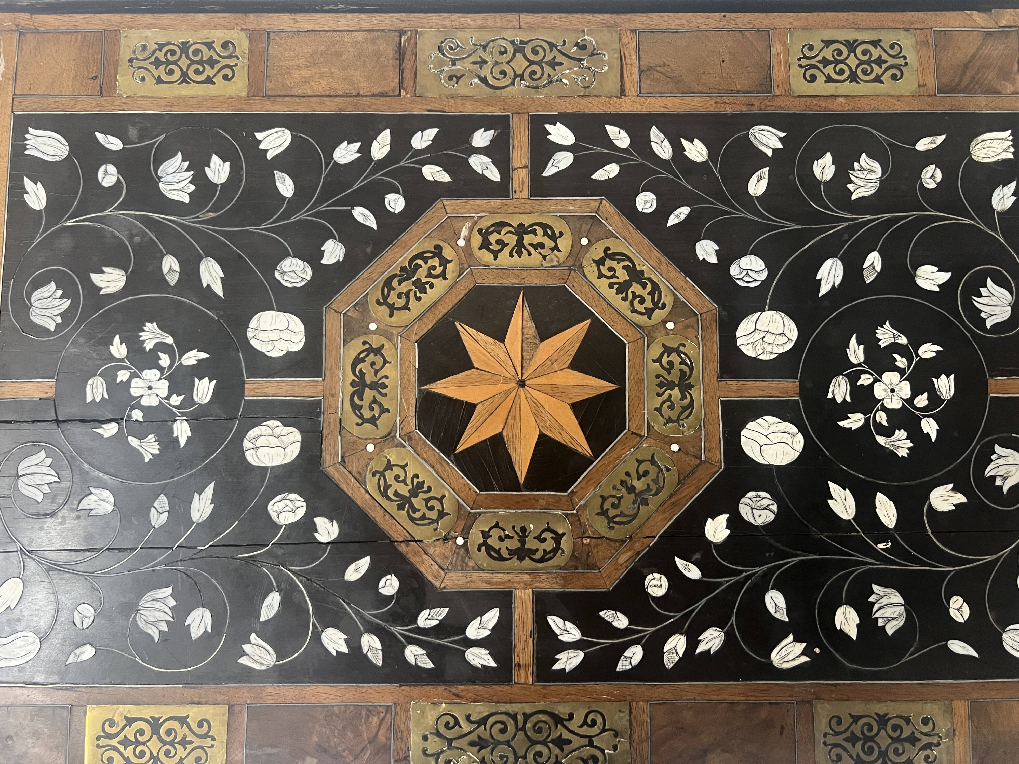 Blackened wood display table with marquetry top, Spain, 19th century.
