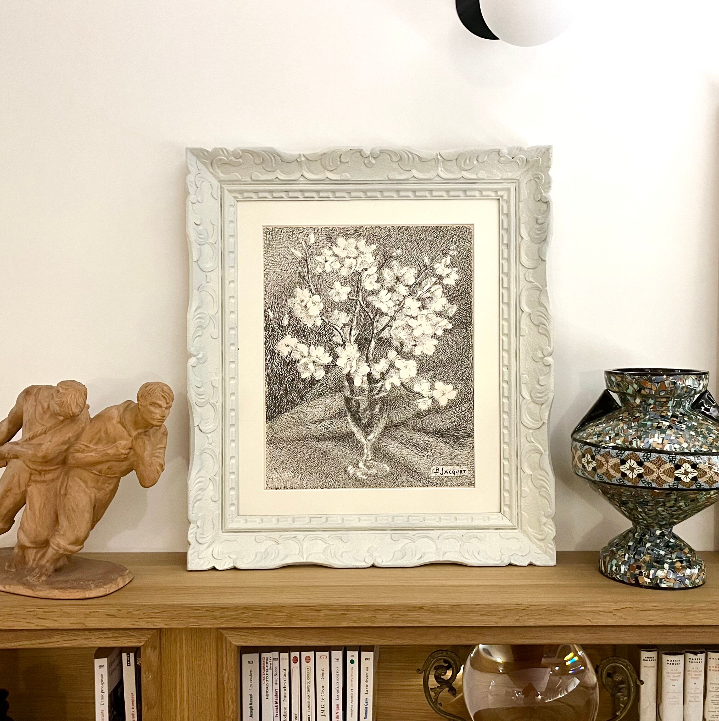 Almond branches in bloom in a glass of water