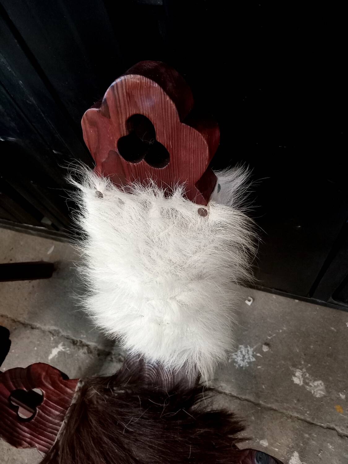 Pair of brutalist tripod chairs in wood and cowhide