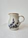 Small vintage stoneware jug with cobalt blue floral decoration.