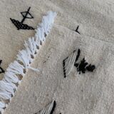 White and black carpet with berber patterns hand-woven in natural wool