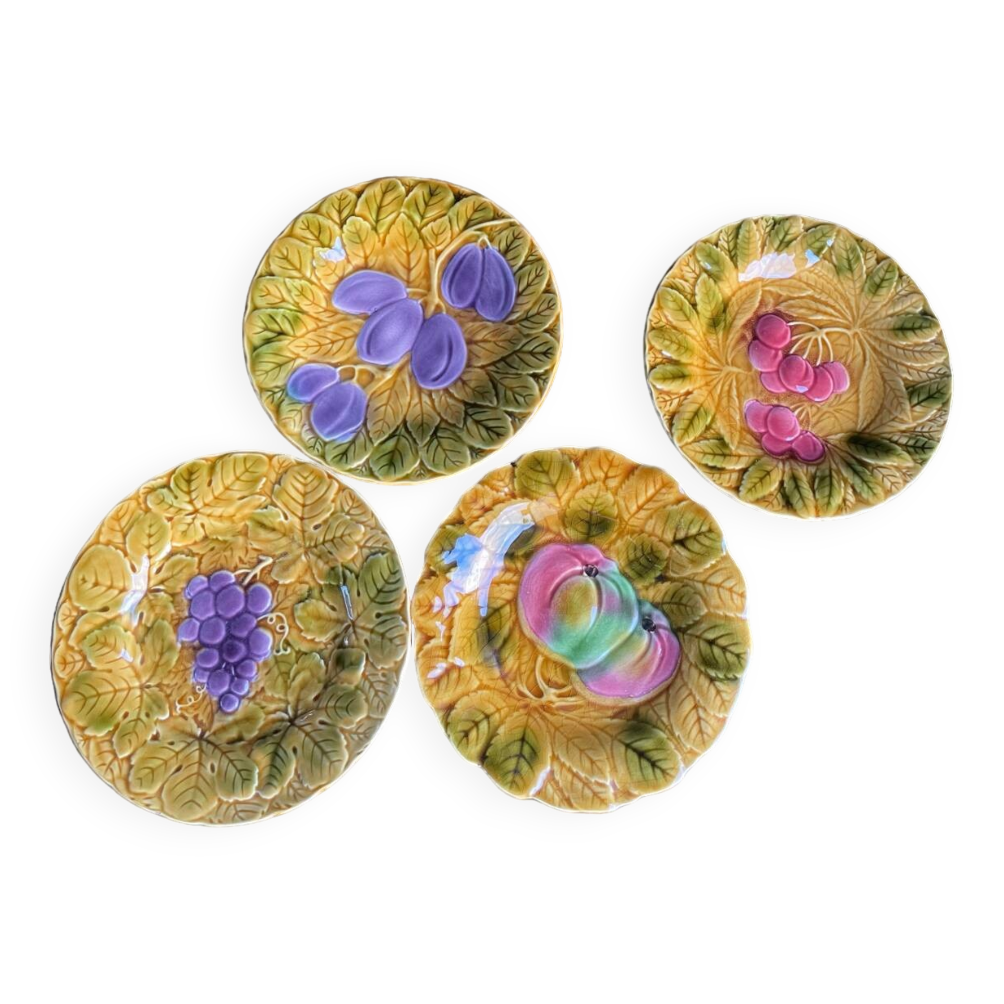 Set of four old Sarreguemines barbotine plates