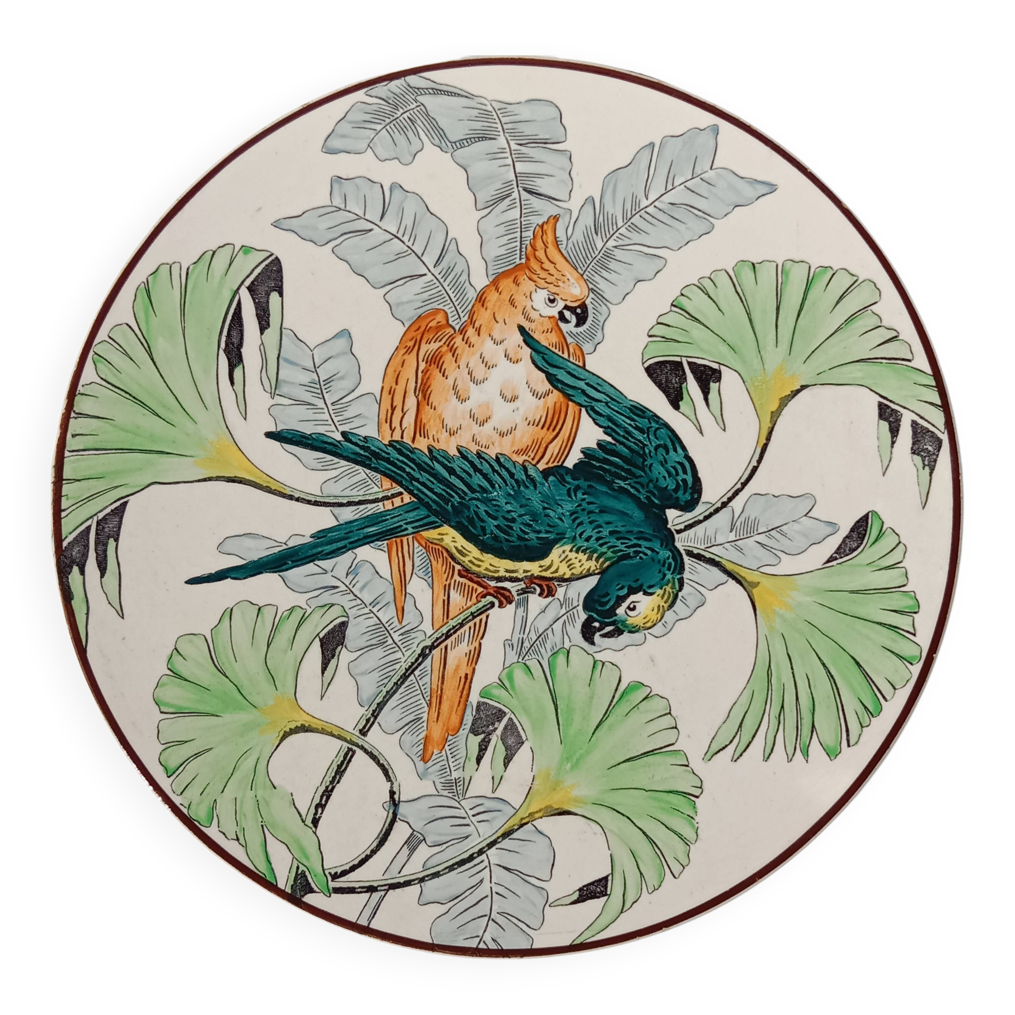 Plat rond à décor de perroquets dans la jungle, circa 1900