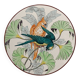 Plat rond à décor de perroquets dans la jungle, circa 1900