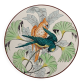 Plat rond à décor de perroquets dans la jungle, circa 1900