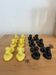 Box of 12 dog-shaped cutlery rests in yellow and black majolica.