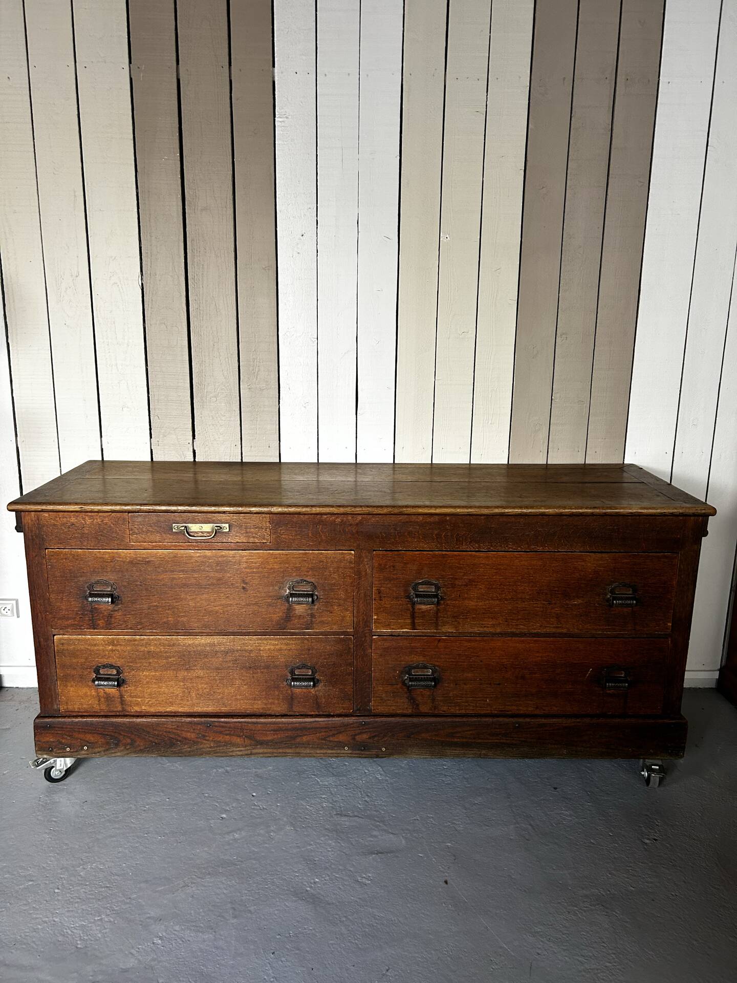 Large antique haberdashery counter in oak