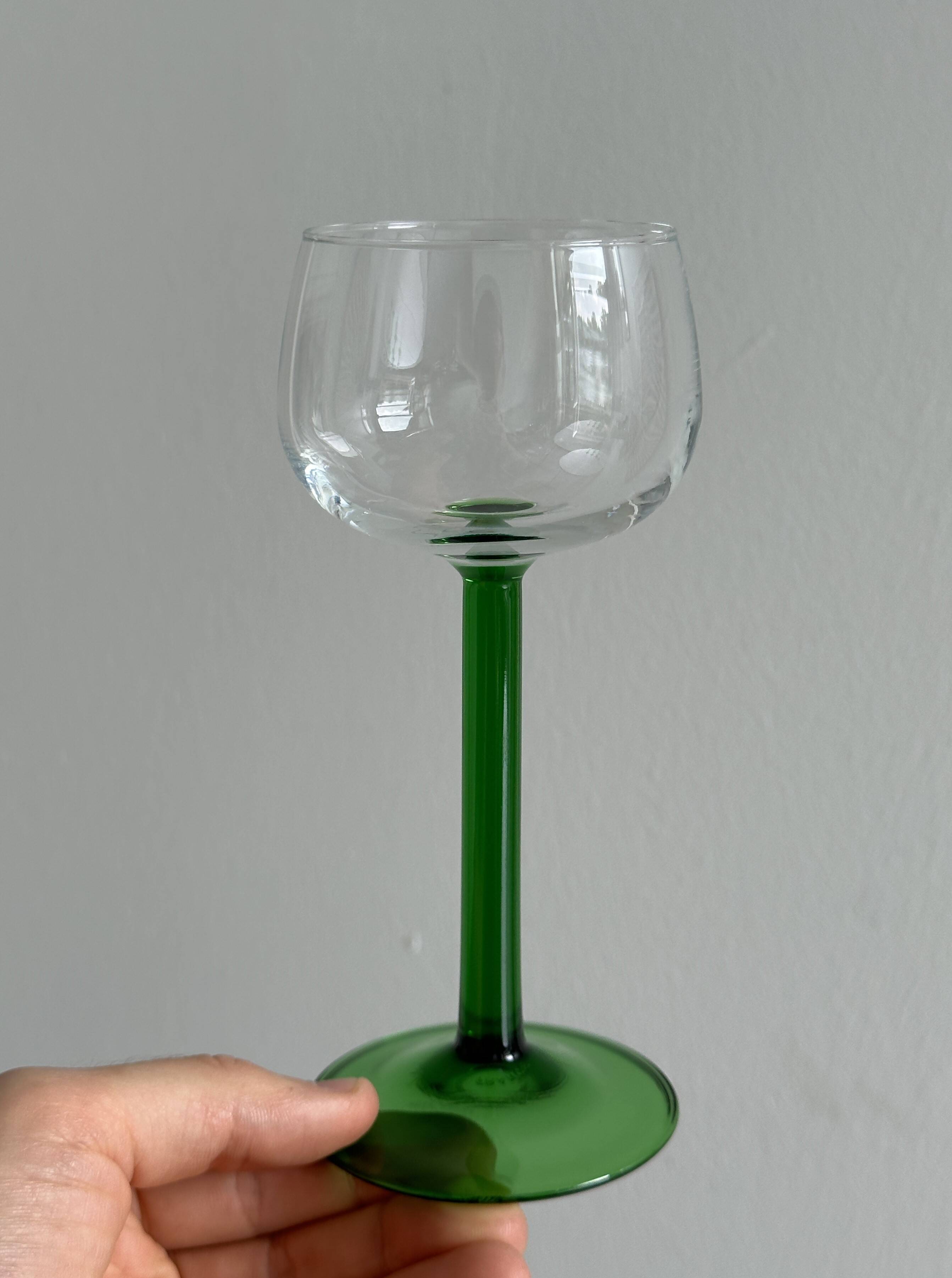8 Alsatian stemmed glasses, transparent glass and green stems.