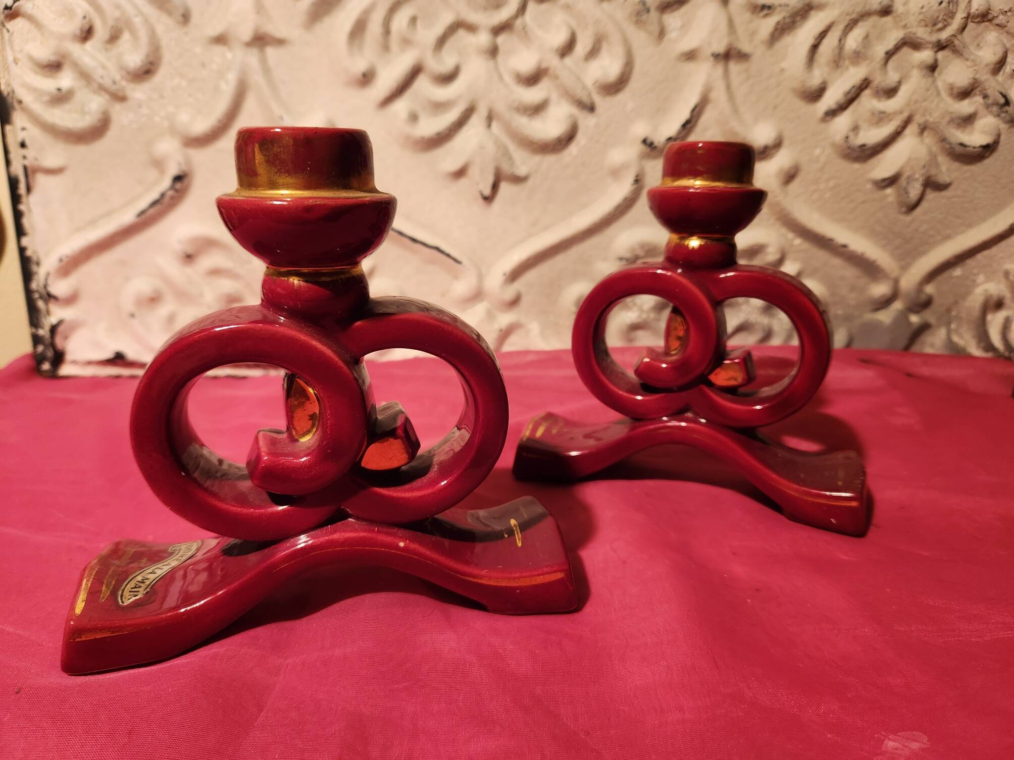 Pair of vintage ceramic candle holders, hand-painted in red and gold.