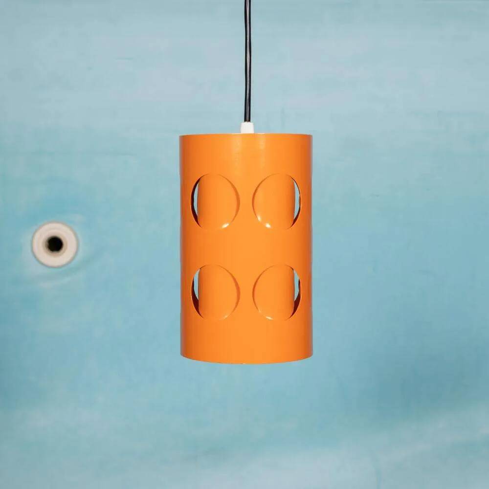 Vintage orange suspension light in a 1970s space age style.