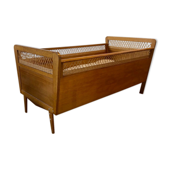 Wooden and wicker baby bed