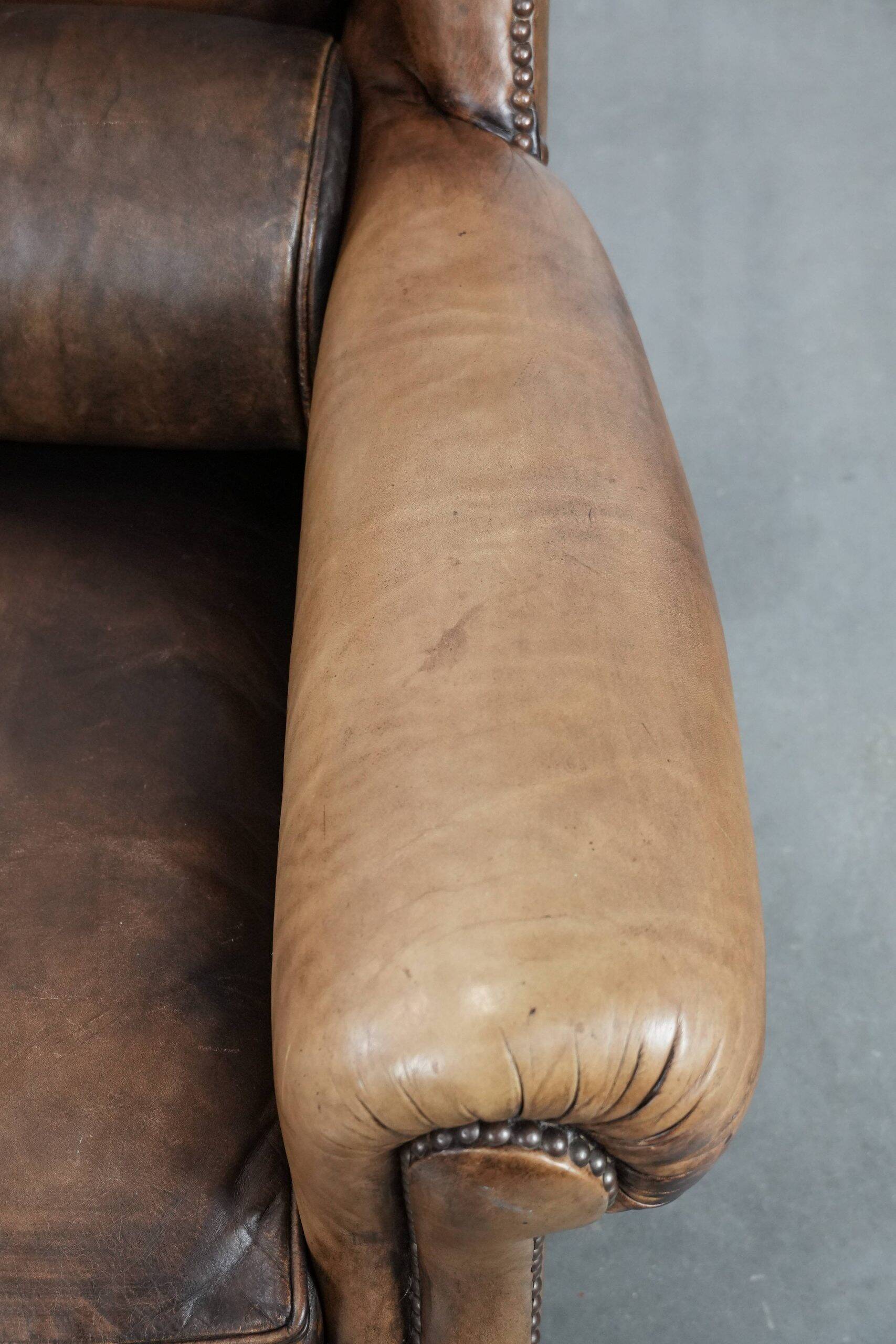 Luxury and large cowhide leather wingback chair in English style