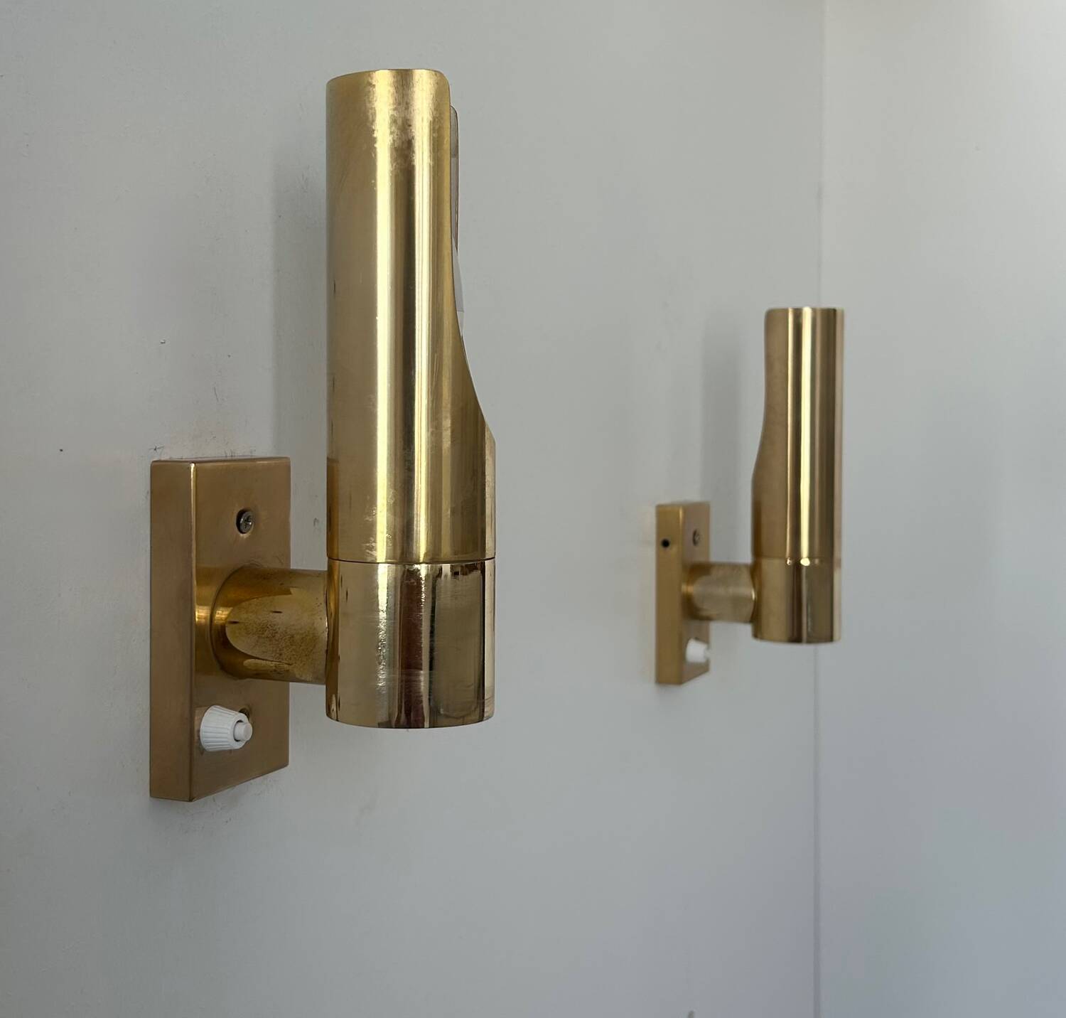 Pair of vintage adjustable brass wall lights, France 1970.