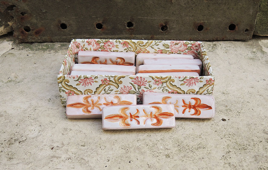 12 ancient fleur de lys knife holders in terracotta