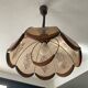 Scandinavian style glass and wood pendant light.
