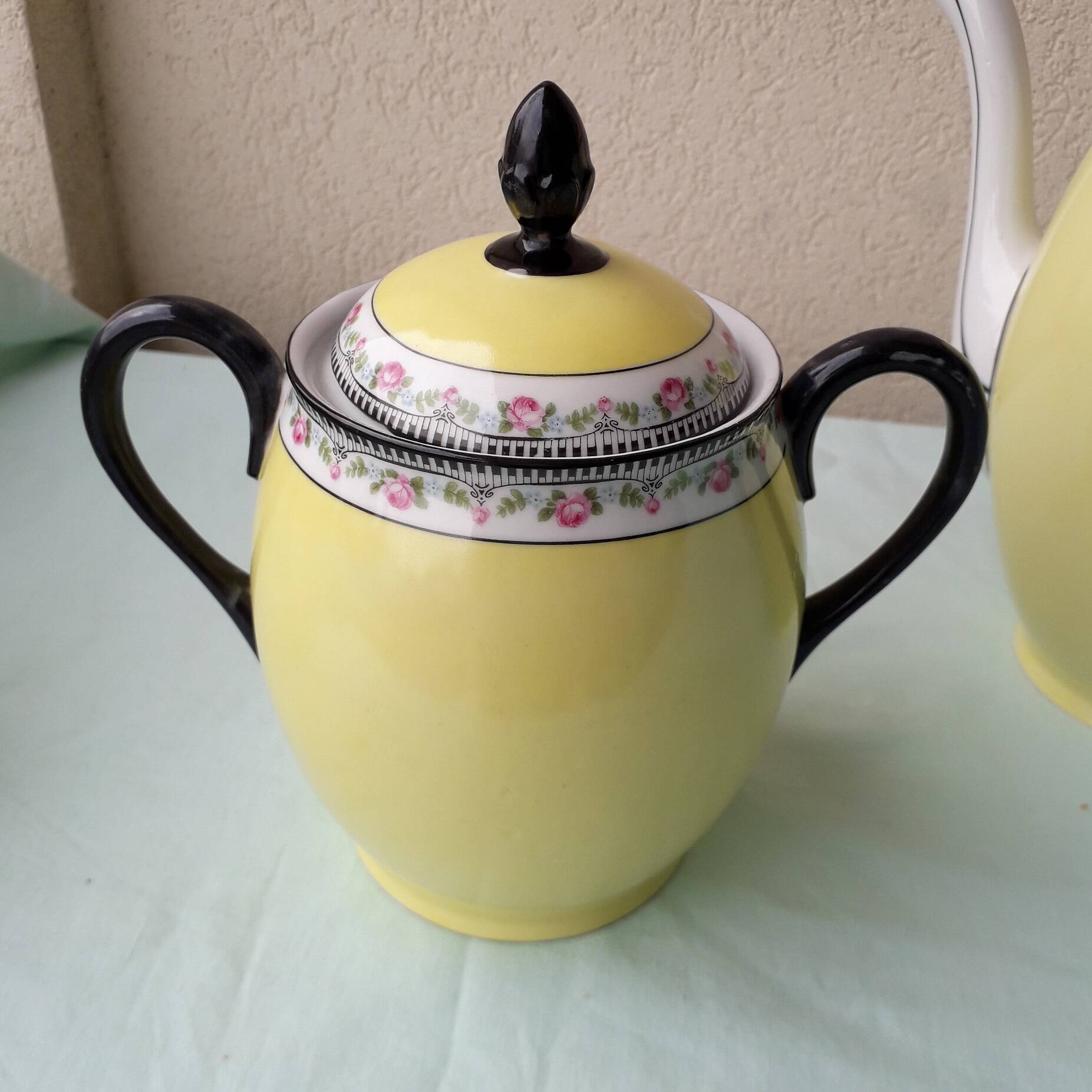 Coffee pot or teapot, sugar bowl and milk jug in porcelain.