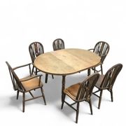 A slightly weathered Windsor wheelback dining set (7) by Oirschotse Meubelindustrie 1950s