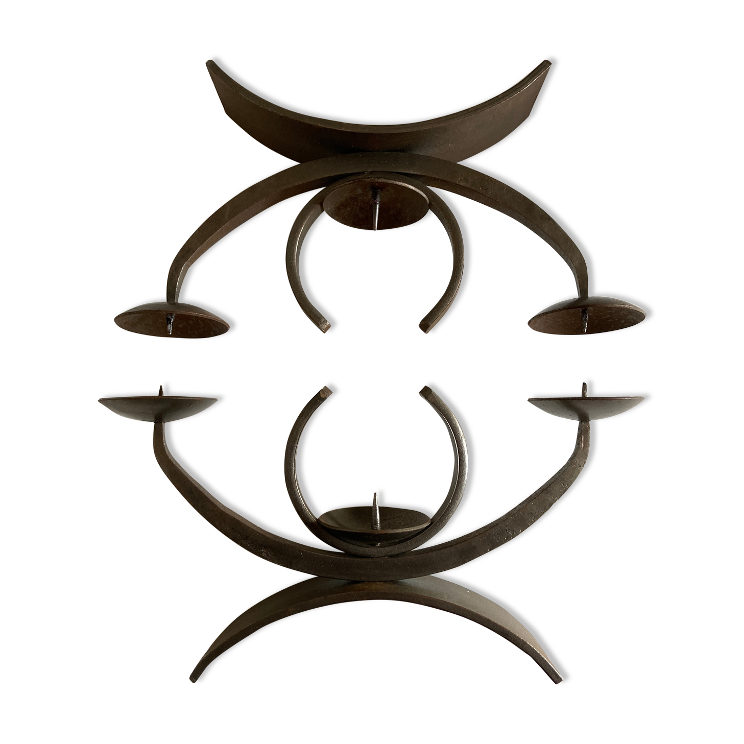 Pair of modernist candlesticks in beaten iron 1970