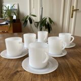 Espresso coffee cup service, Nestlé promotional items, in white glass.