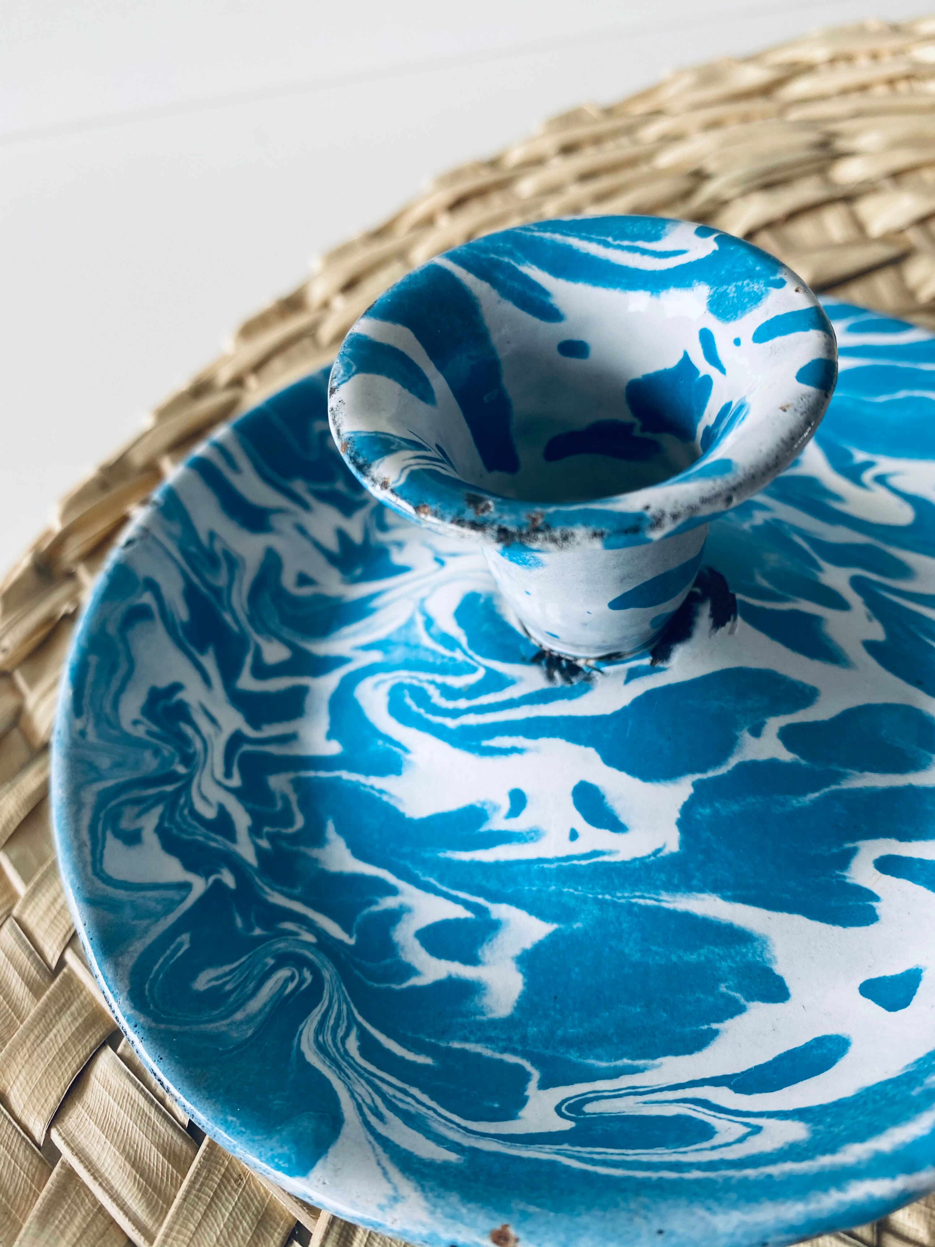 Old enamelled metal candlestick