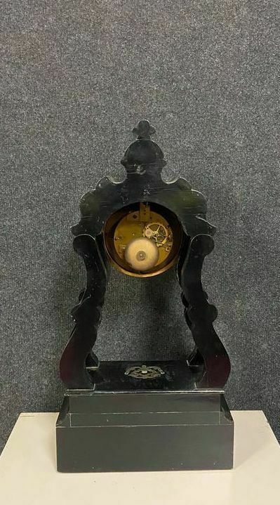 Portico clock of eventful shape of napoleon III period blackened wood inlaid with brass