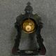 Portico clock of eventful shape of napoleon III period blackened wood inlaid with brass