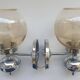 Pair of chrome metal wall lights with vintage sandblasted glass globes
