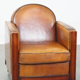 Sheep leather and wooden Art Deco design armchair with ball feet