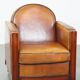 Sheep leather and wooden Art Deco design armchair with ball feet