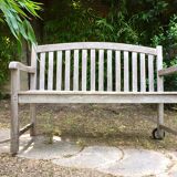 Vintage wooden garden bench with wheels