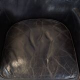 Subtle black armchair with reversible Kelim seat cushion