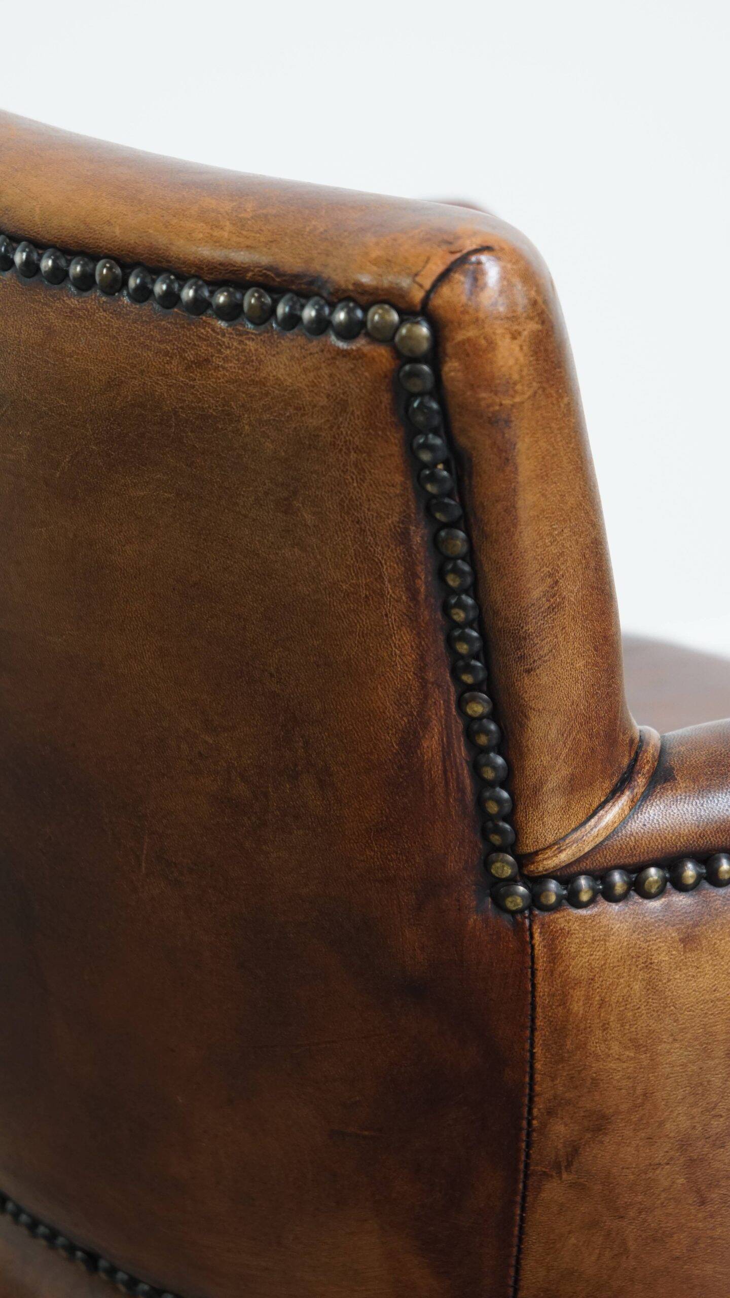 Amazing cognac-coloured sheepskin dining/side chair with armrests
