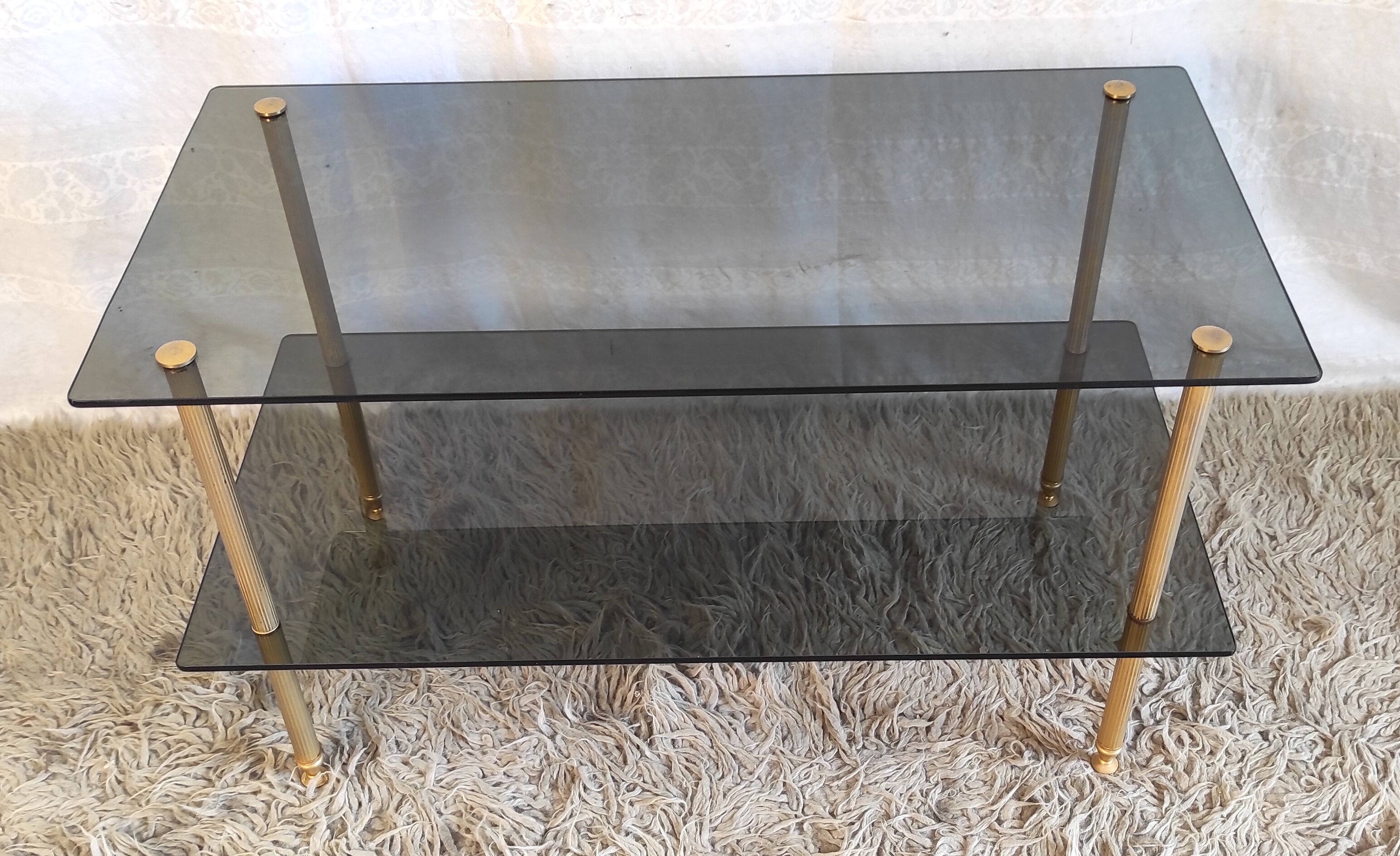 Coffee table in gilded metal and smoked glass – 60s