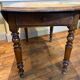 Table with oval shutter in walnut foot turned
