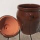 Large glazed terracotta jar, cognac colour with its lid.
