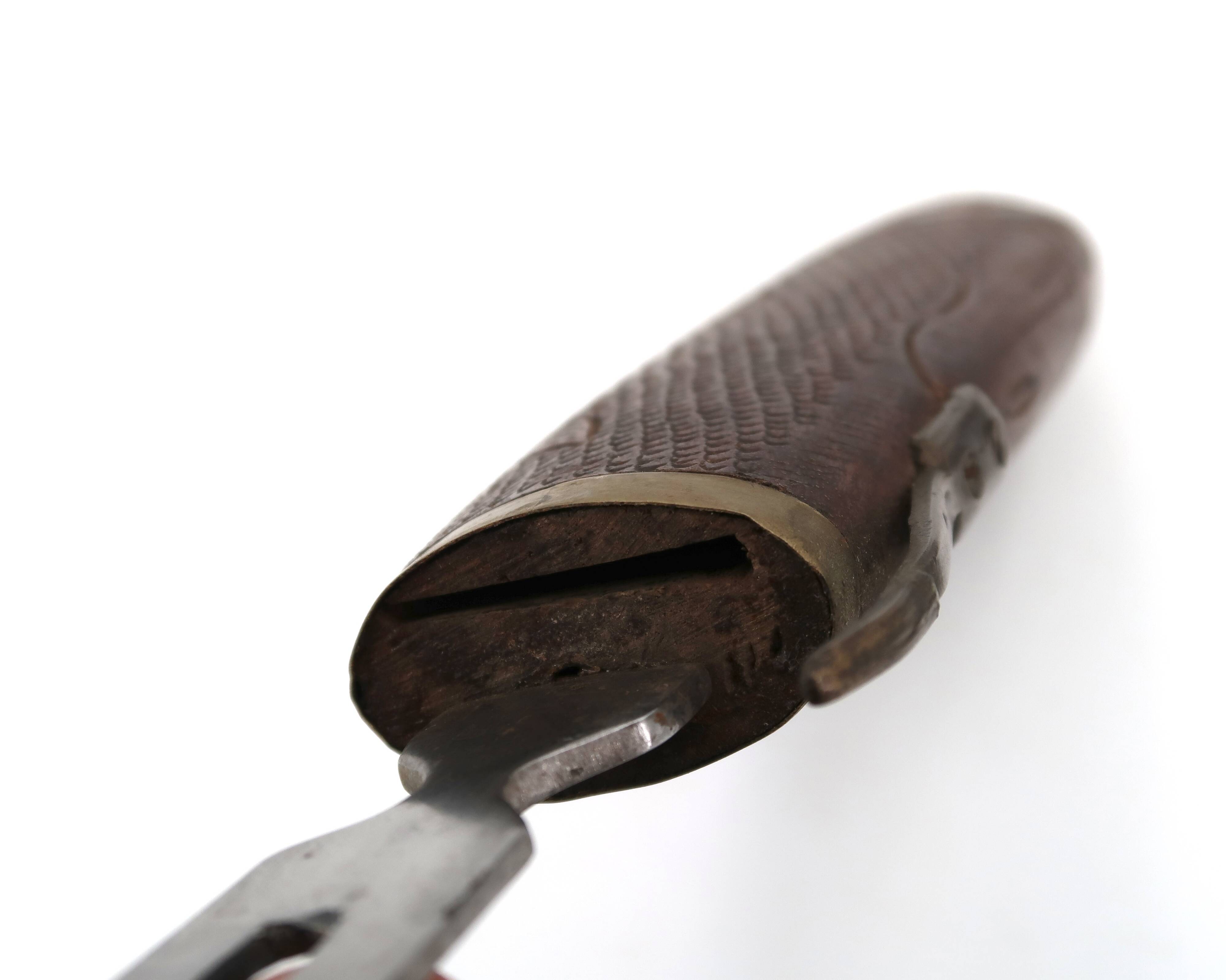 Fish knife and fork with a wooden and brass sheath sculpture.