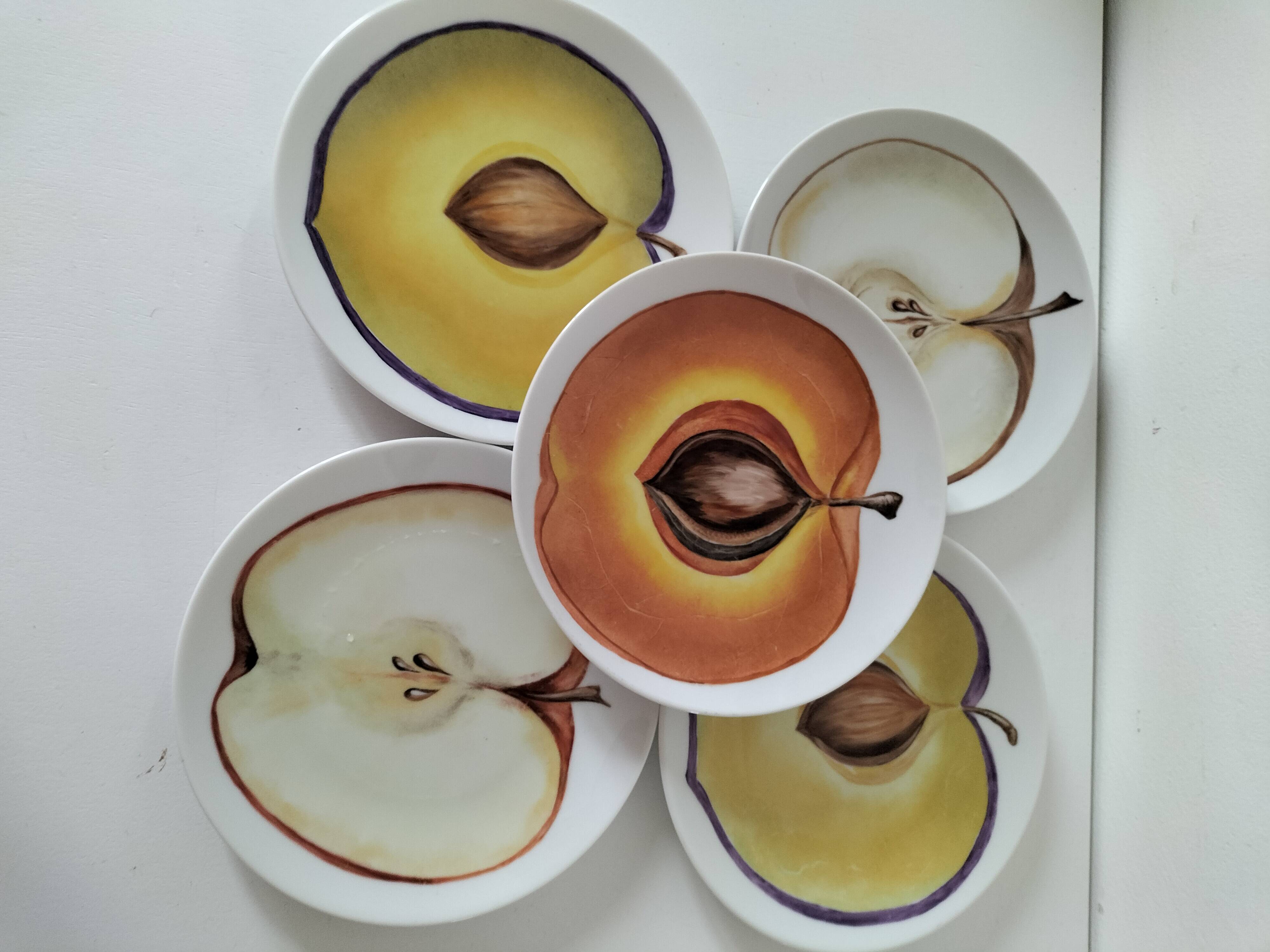 5 hand-painted dessert plates with stylised fruit designs.