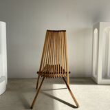 Foldable designer armchair in wooden slats
