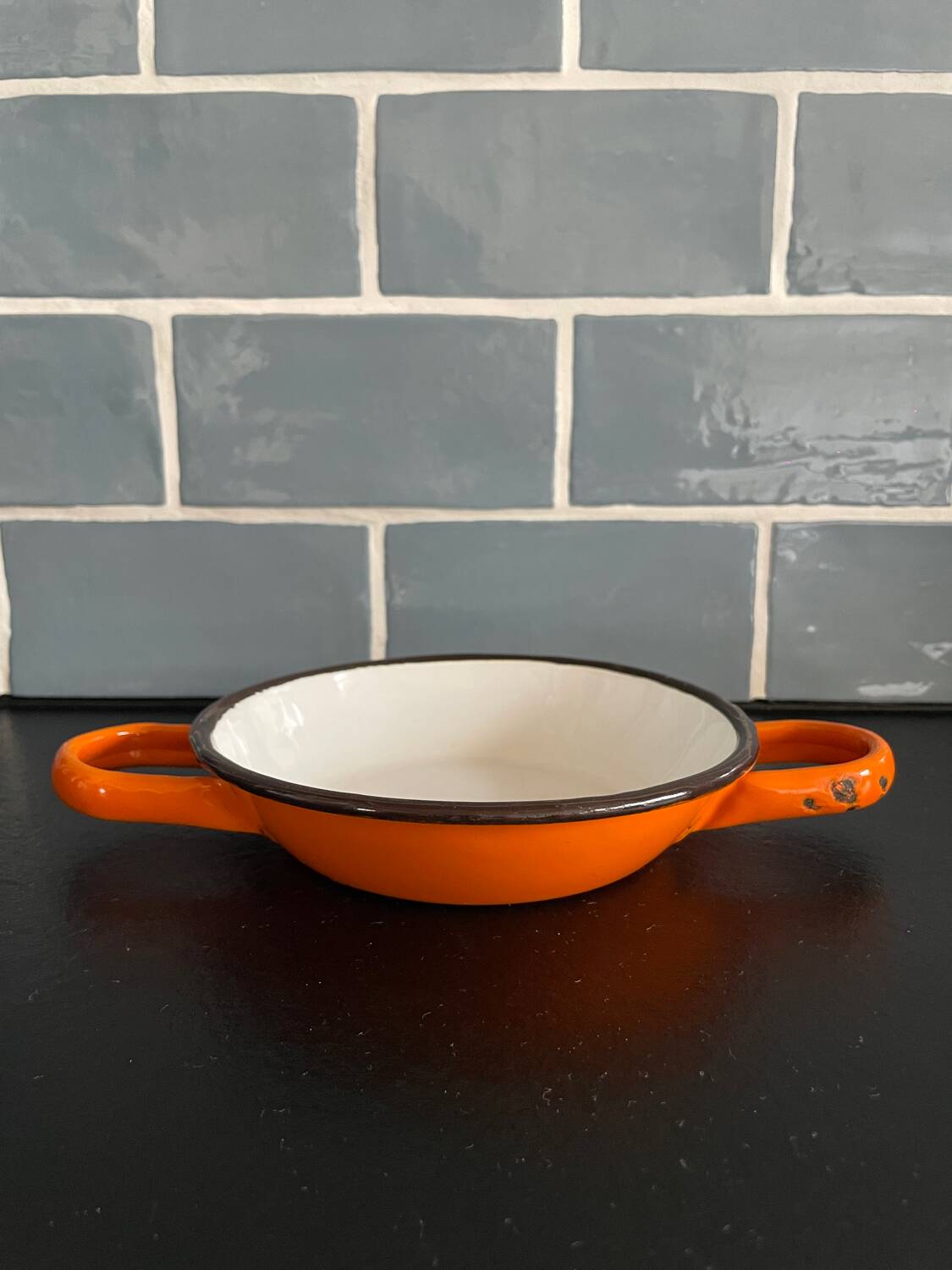 Orange enameled sheet egg dish
