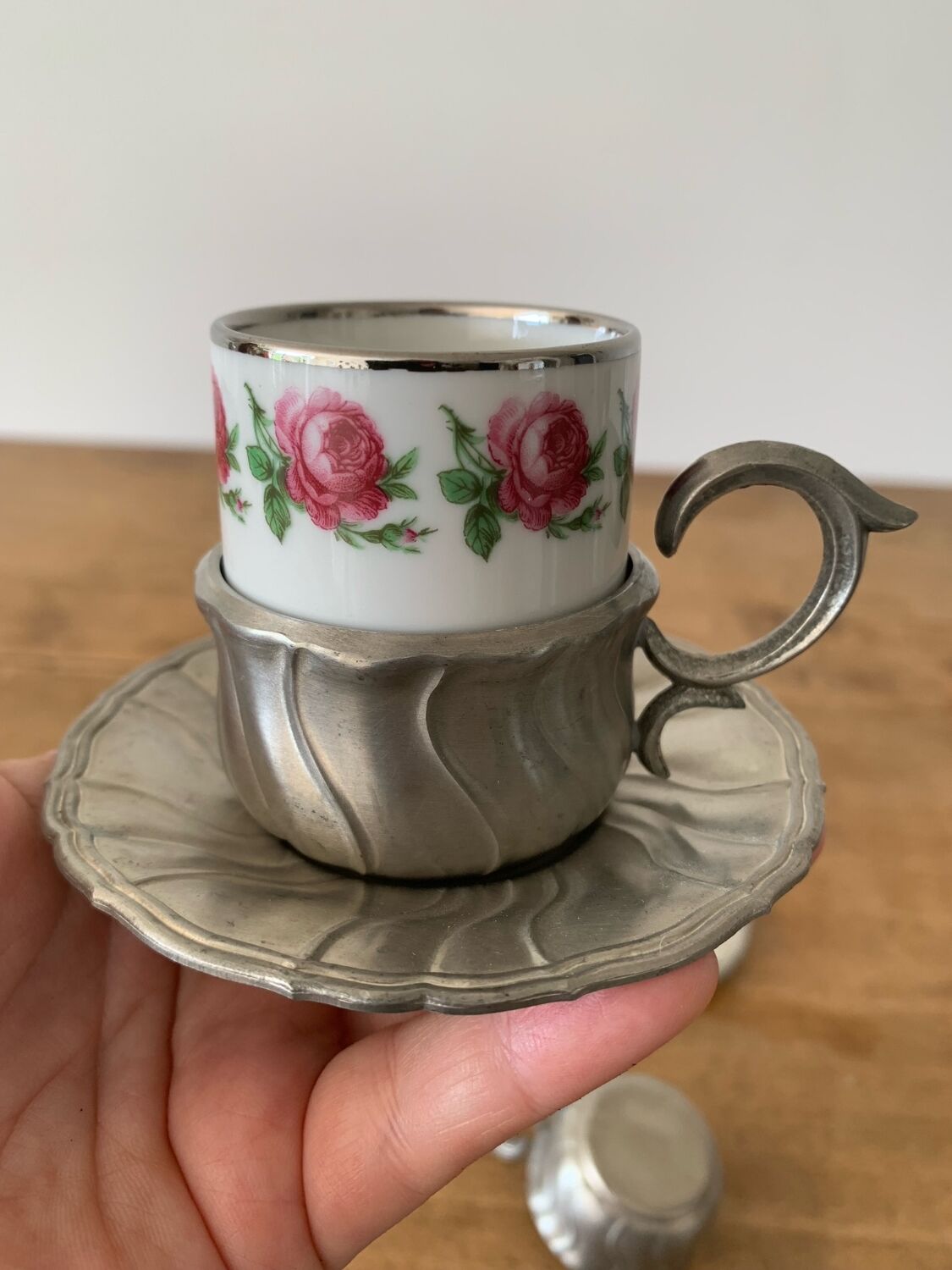 2 small porcelain cups and their pewter cup holders