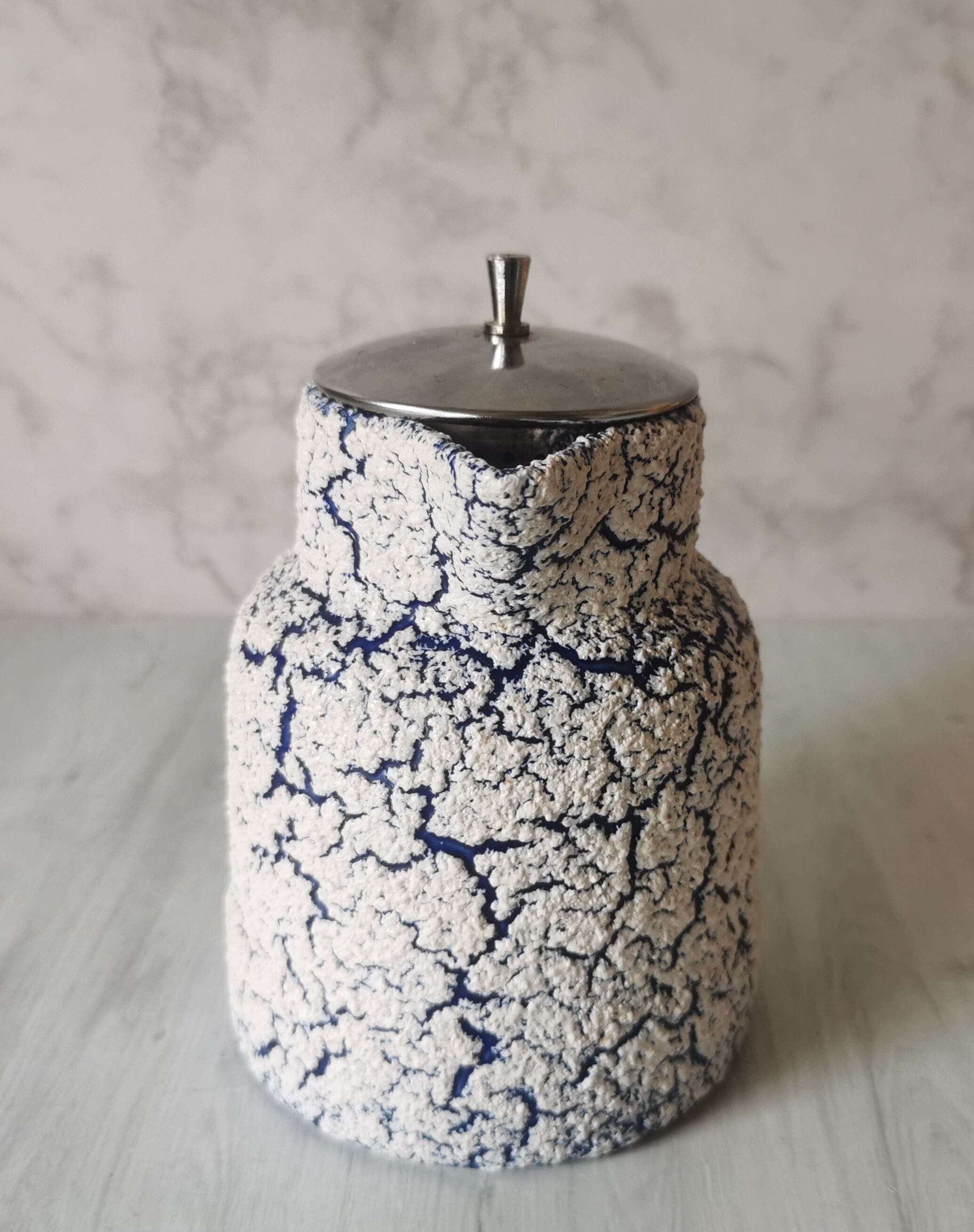 Cracked and enamelled ceramic teapot