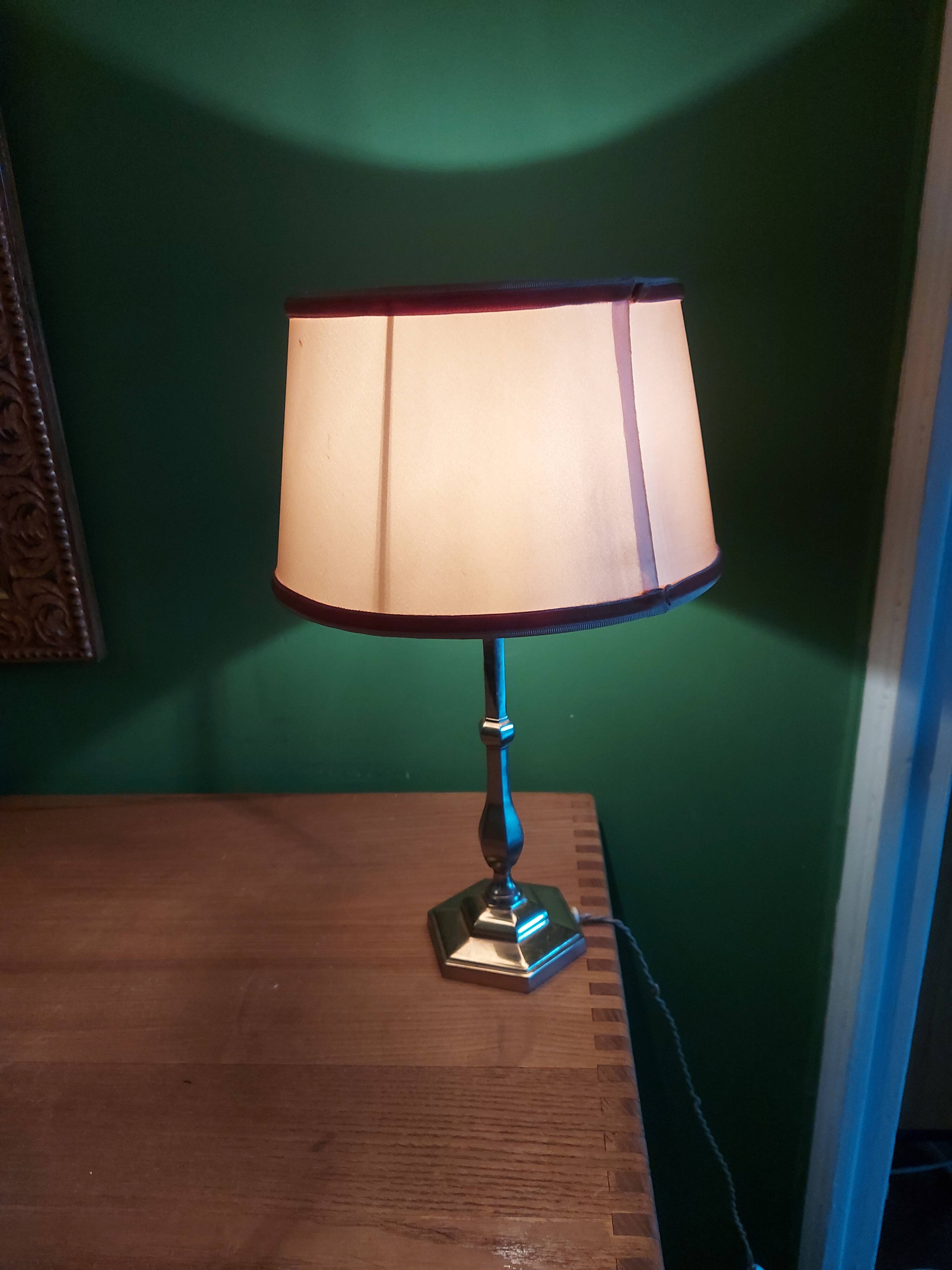 Silver metal lamp with its lampshade