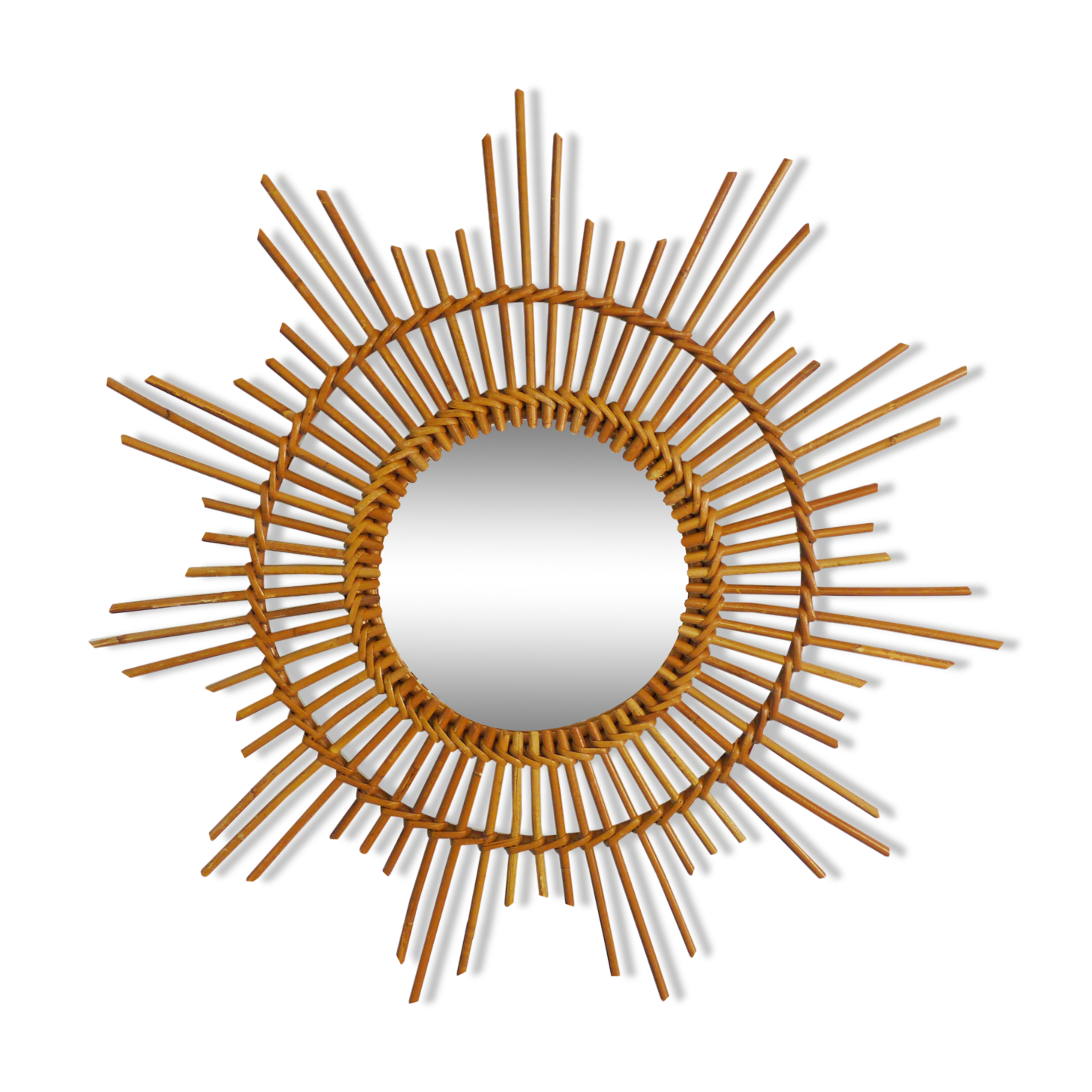 Vintage rattan sun mirror. Year 60